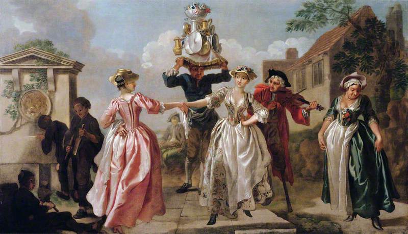 Ladies in Georgian dress dance around a servant with basically a table setting on his head while a fiddler plays